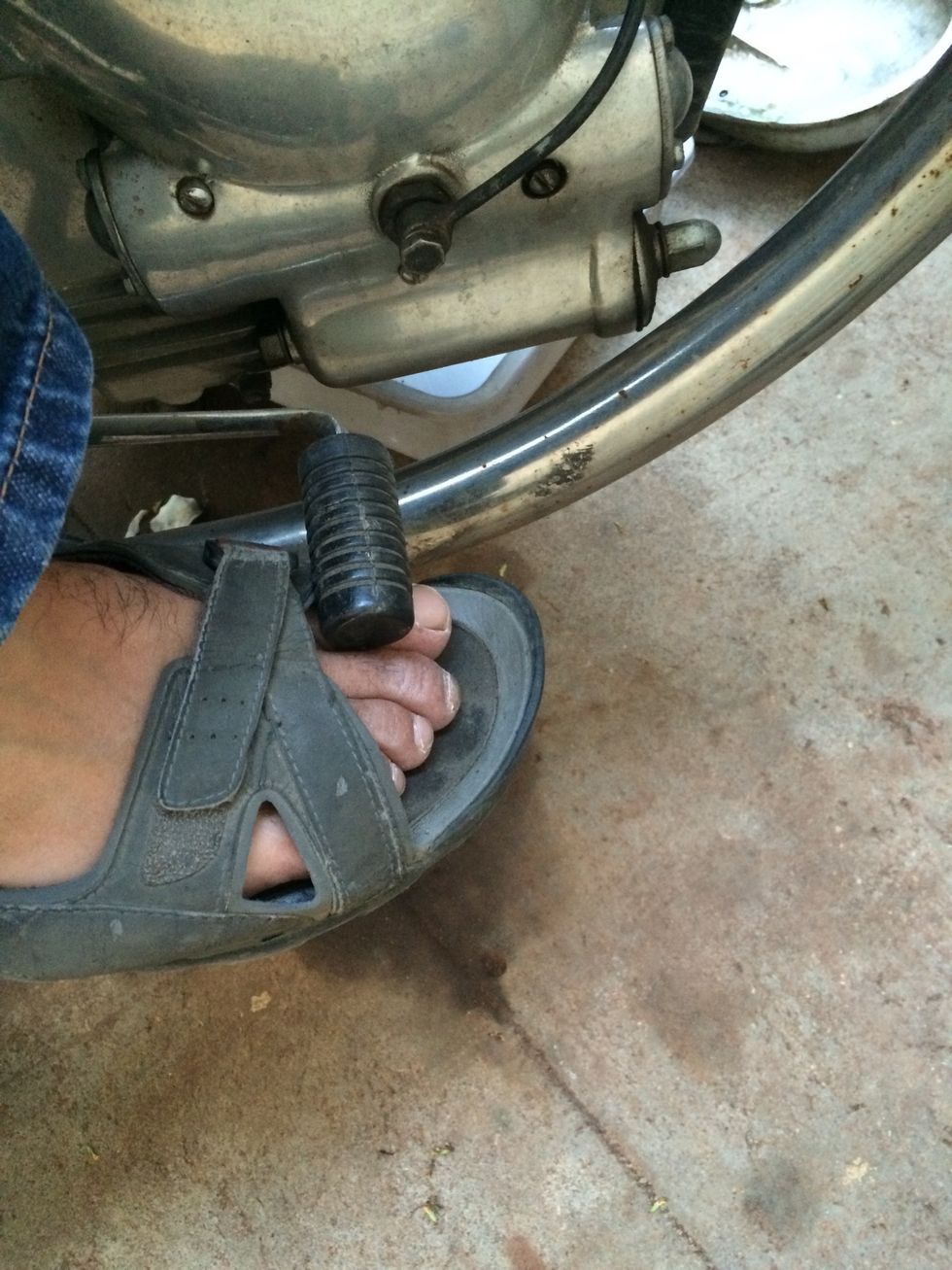 Engage first gear for aiding the clutch plate housing bolts removal