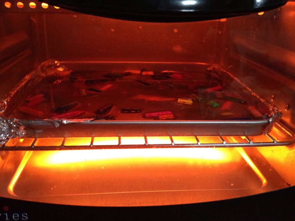 Ensure all crayons are of the same brand or they'll melt at different rates. This causes the ones that melt faster to turn into fumes which may be detrimental to health. 235 degrees Celsius for 15 min