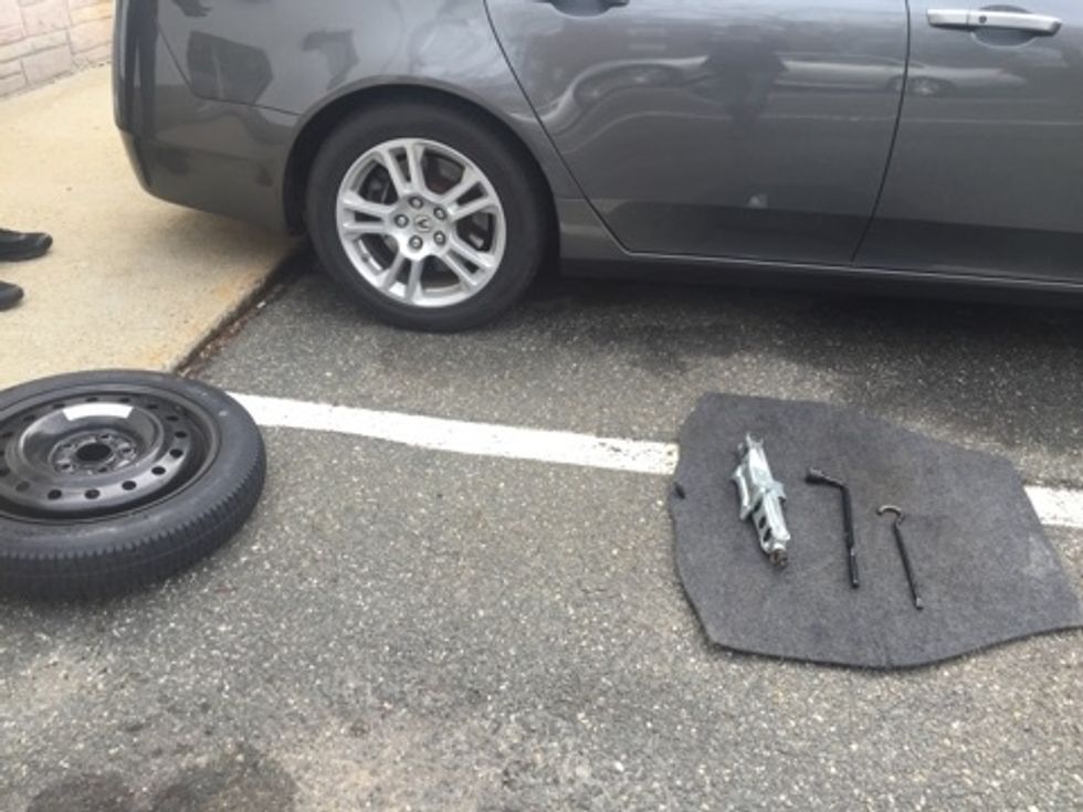 Ensure you have all the needed supplies readily available. As you see pictured here, you can use the trunk flooring to gather your tools. It can also be used to kneel or lay on.