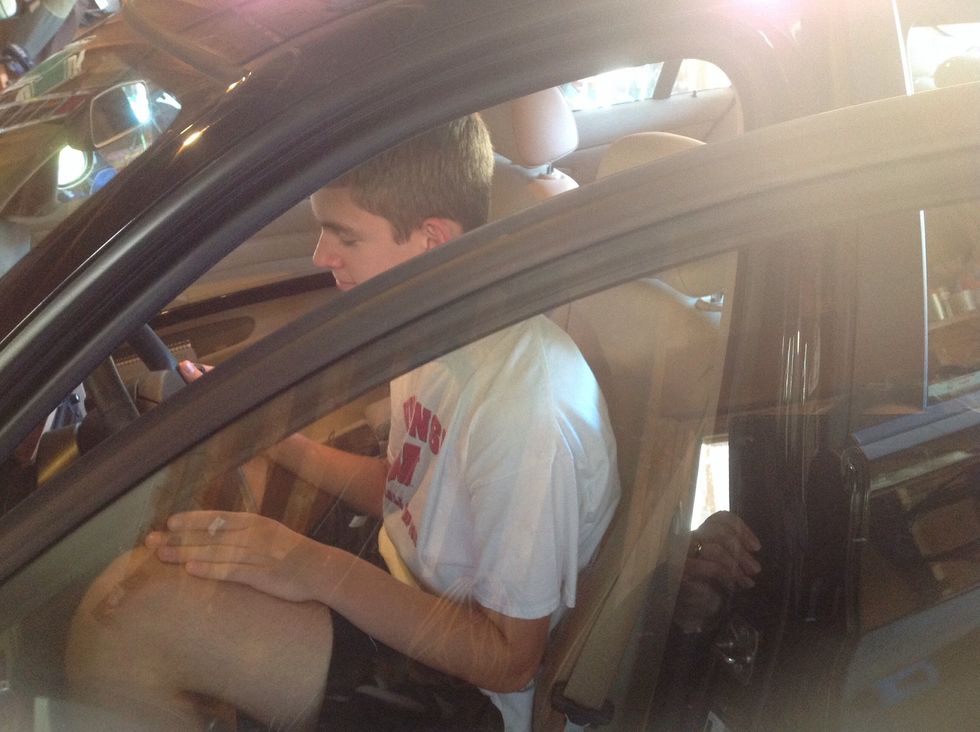 Enter the car, sitting in the seat