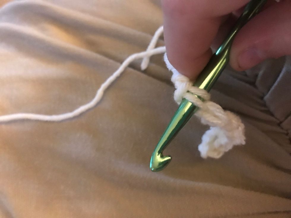 Enter your crochet hook into the stitch and do the same thing we did.