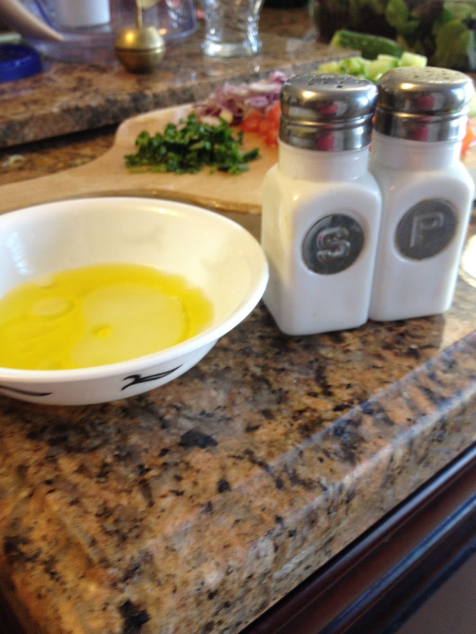 Equal parts olive oil and lemon juice. I only had lime so I used that. Add this once the quinoa has cooled, otherwise it will absorb too much of the dressing. Don't forget salt and pepper!