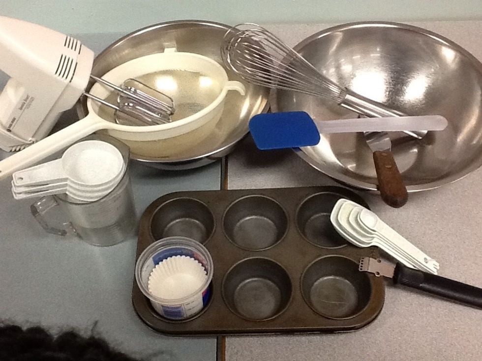 Equipment needed:  sieve, medium and large mixing bowls, electric mixer, liquid measure, dry measures, small measures,  rubber spatula, zester, whisk, muffin tin, cupcake liners, and a metal spatula.