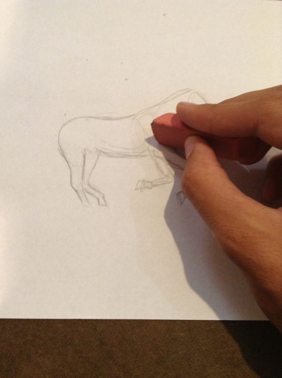 Erase any unnecessary lines. This is why I said to draw lightly.