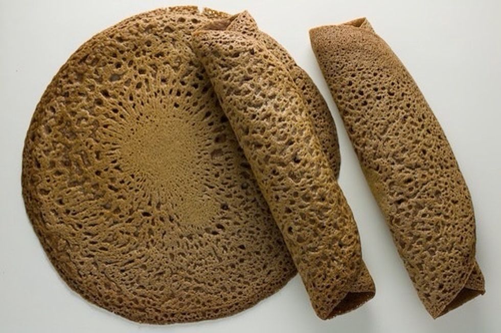 Ethiopian food is traditionally eaten with a flatbread called injera, which is like nothing you've ever tasted. Imagine a dosa made from sourdough. Now the bad news: I can't get real injera anymore!