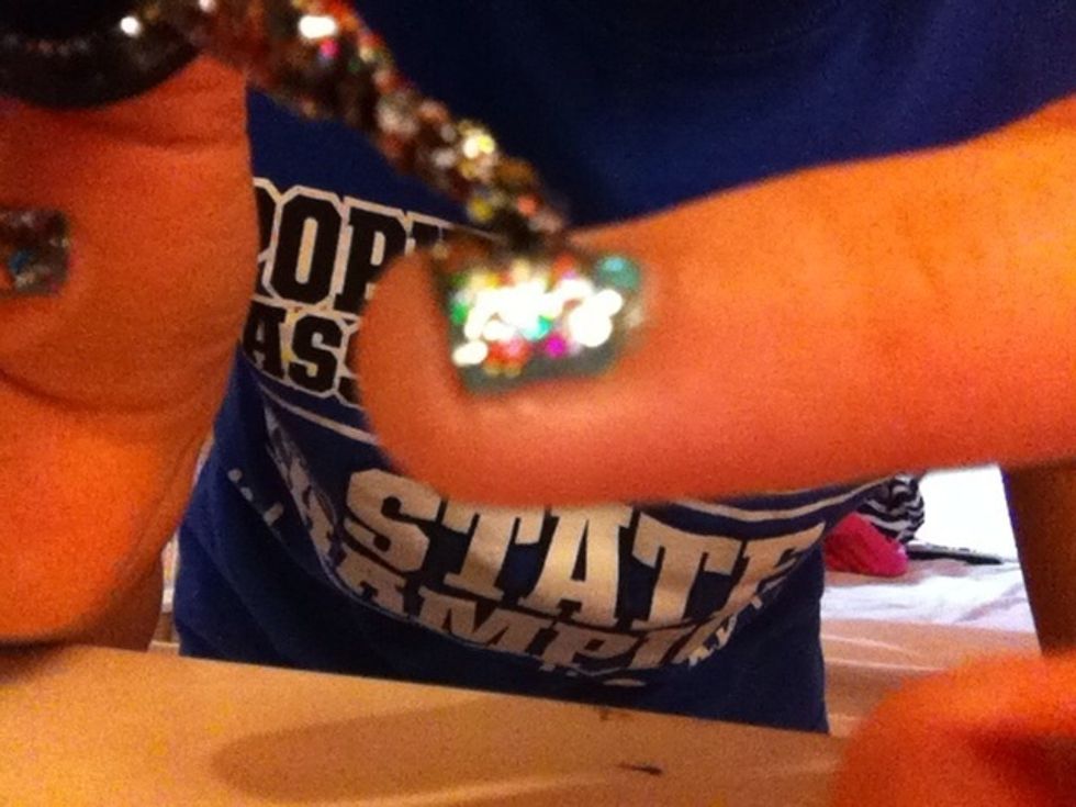 Evenly and generously spread on your nails (once the base has dried). Sorry my camera kept focusing on me and not the polish