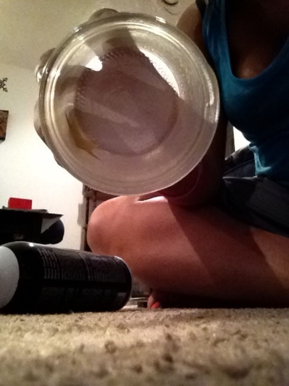 Evenly coat the inside of your jar with the spray glue.