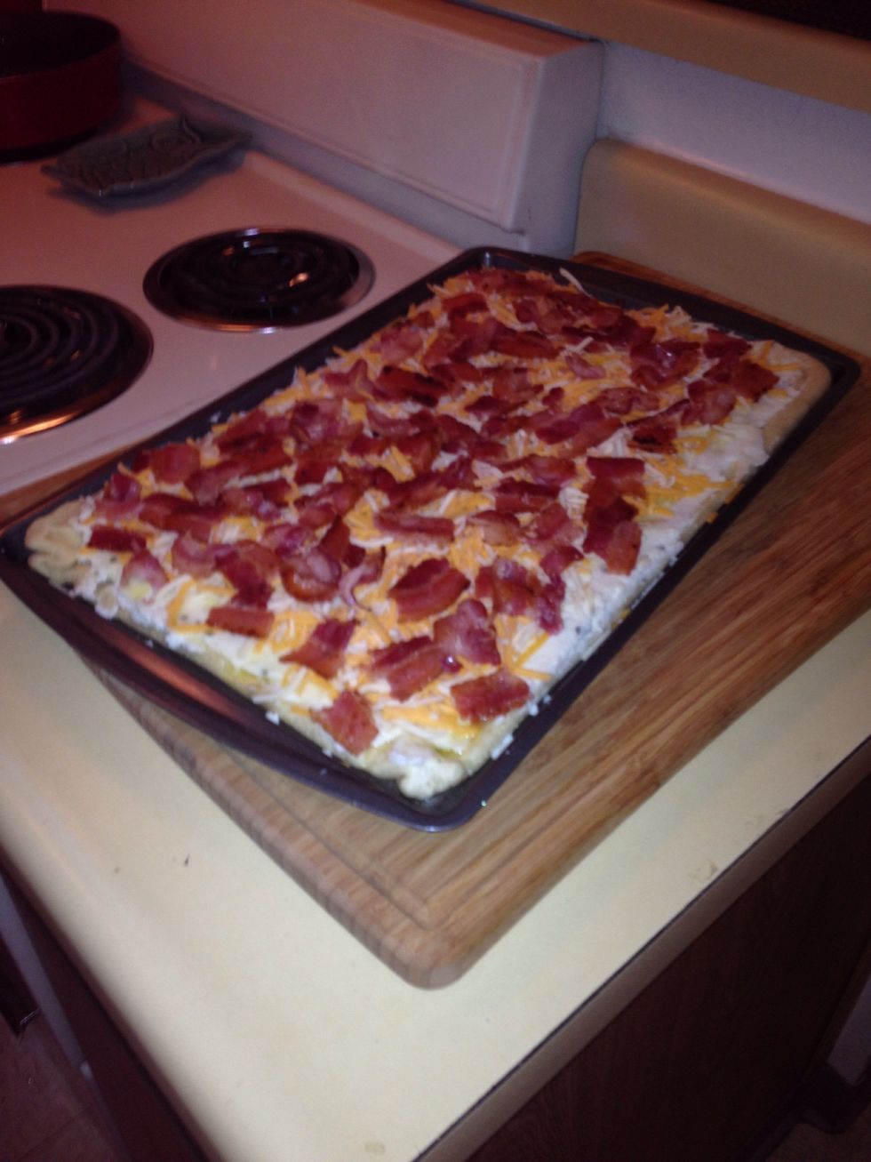 Evenly distribute cheese over the pizza. And now! Add the bacon \ud83d\ude0a you can add toppings such as chives, onions, tomatoes, olives, etc. This is the most basic recipe! Play around with it!