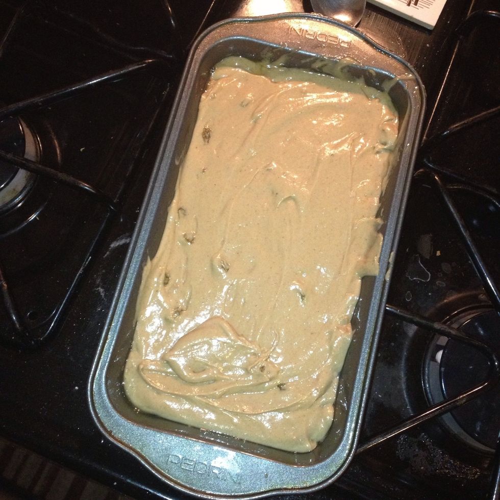 Evenly pour the batter into a greased loaf pan. Smooth the top with a spatula.