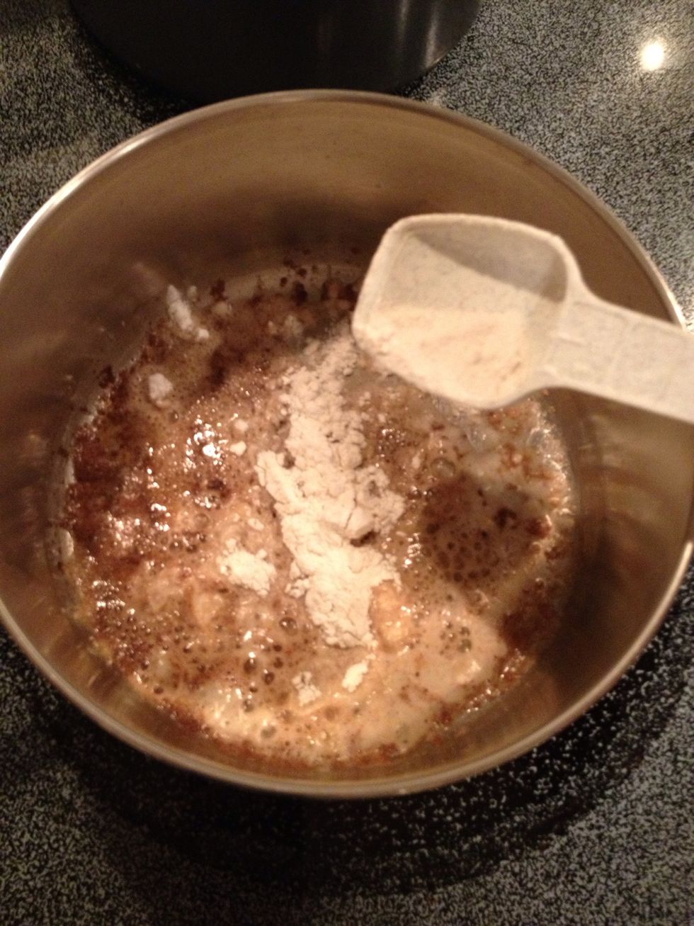 Evenly spread flour on top of melted butter. It's OK if butter browns, but watch carefully so it doesn't burn.