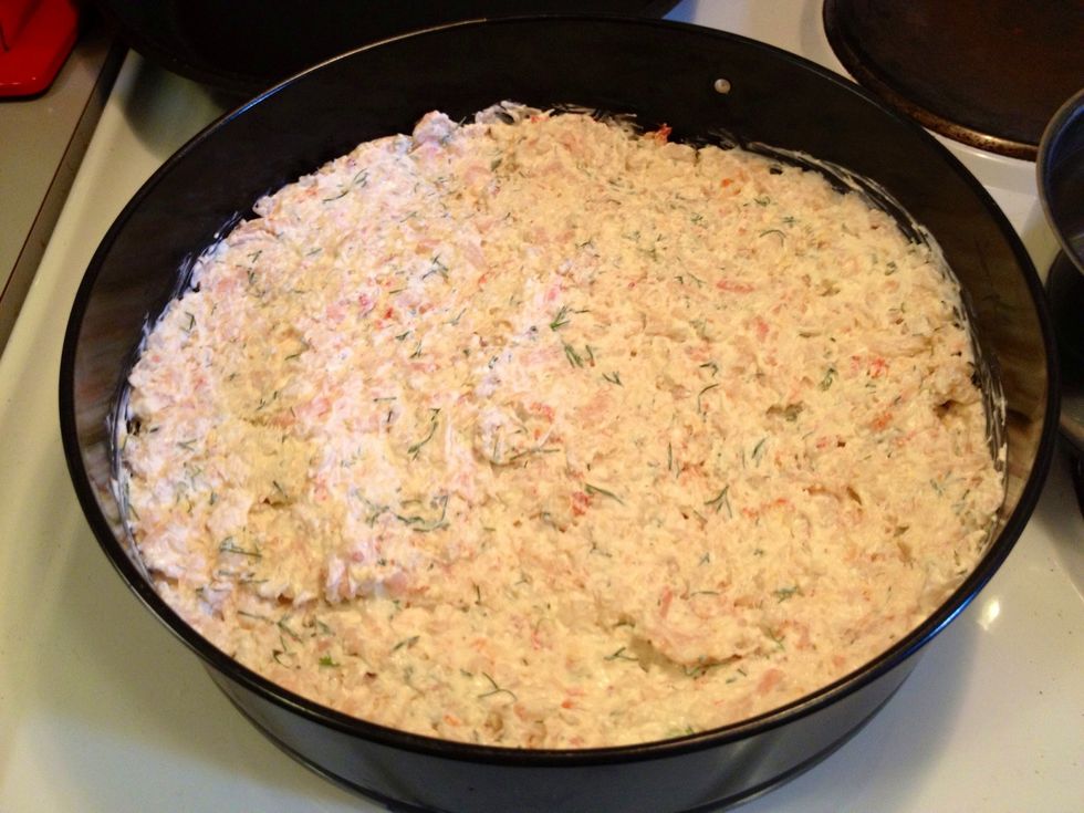 Evenly spread the seafood mix on top of the breadcrumbs. Put in the fridge again, over night or at least for a couple of hours to allow it to "set".