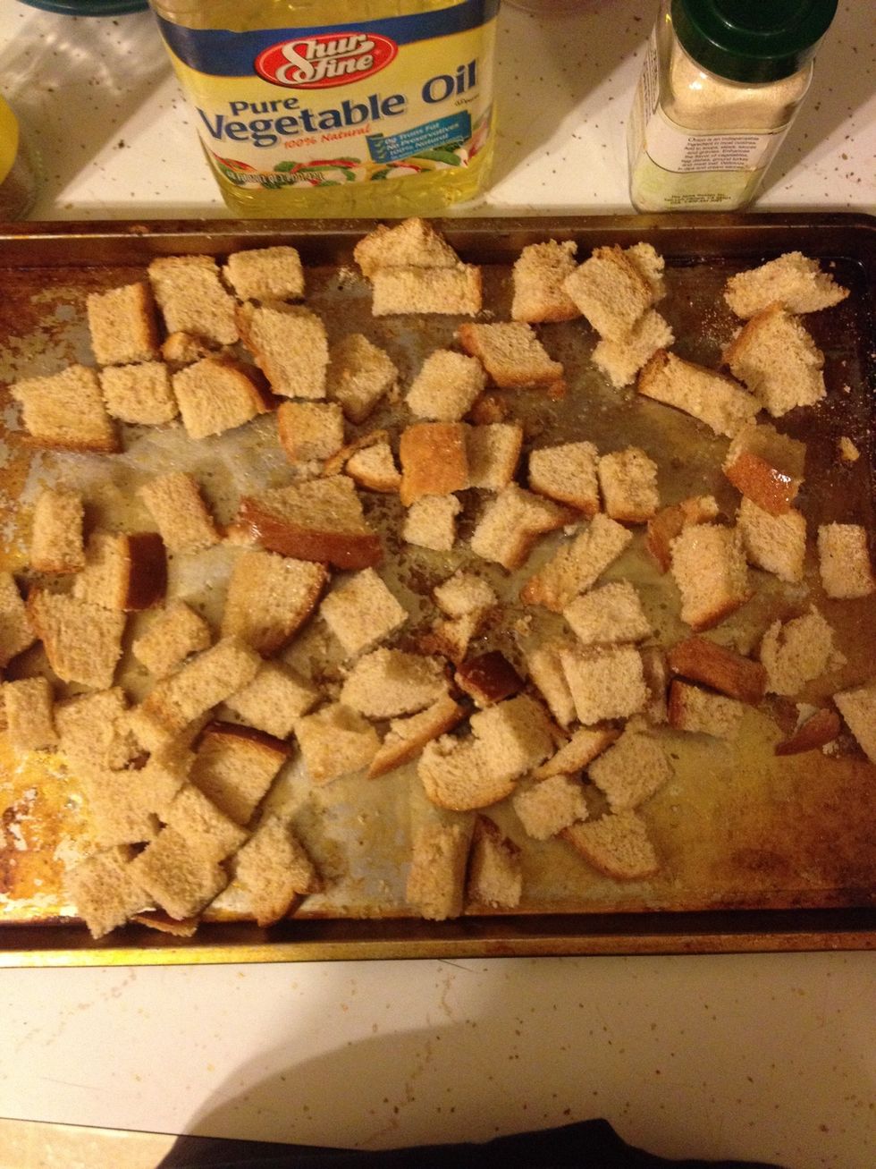 Evenly sprinkle the Italian seasoning, garlic powder, and salt over top. Then drizzle the olive oil over top as well.