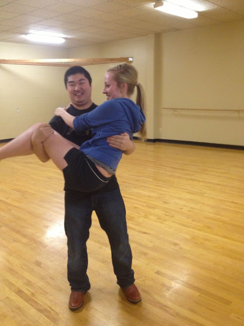 Everything from here is the same as before just in reverse. It's very awkward the first few times you do it. But toss her upwards and have her left leg go over your head.