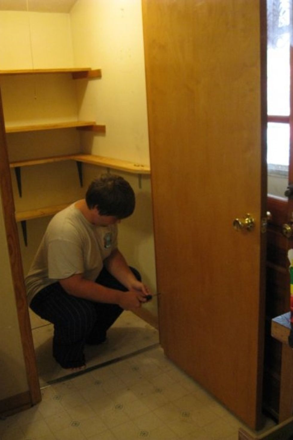 Everything out! Then, my eldest takes off the door and takes the shelves down.