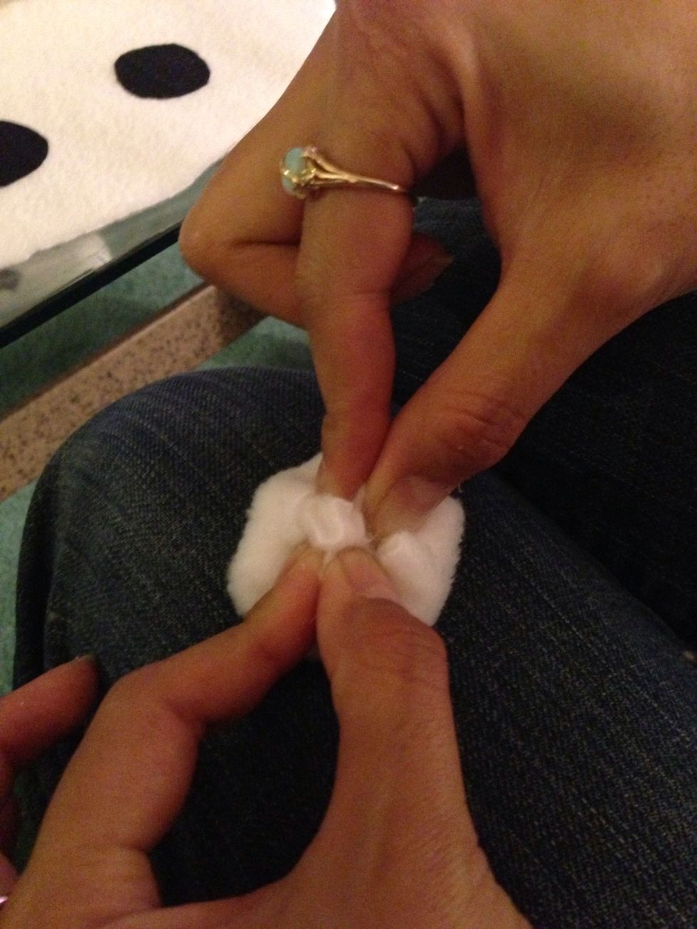 Example: im taking the rest & pressing into the eyeball to give it some bend. Take ur glue and start gluing the middle in. Ur fingers are going to get a lil sticky but its ok.