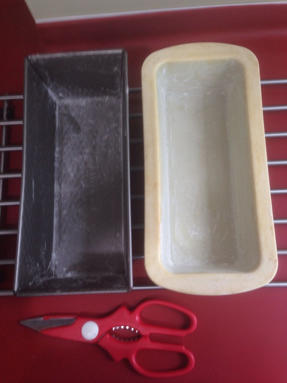 (Excuse my scissors) butter and flour 2 loaf pans