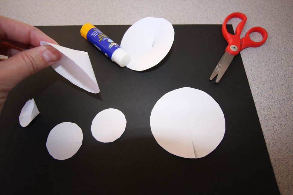 Experiment with rolling, cutting, or folding to alter your shape into a form. Use a glue stick to hold paper form together.  Continue to alter all shapes in exactly the same way as the first.