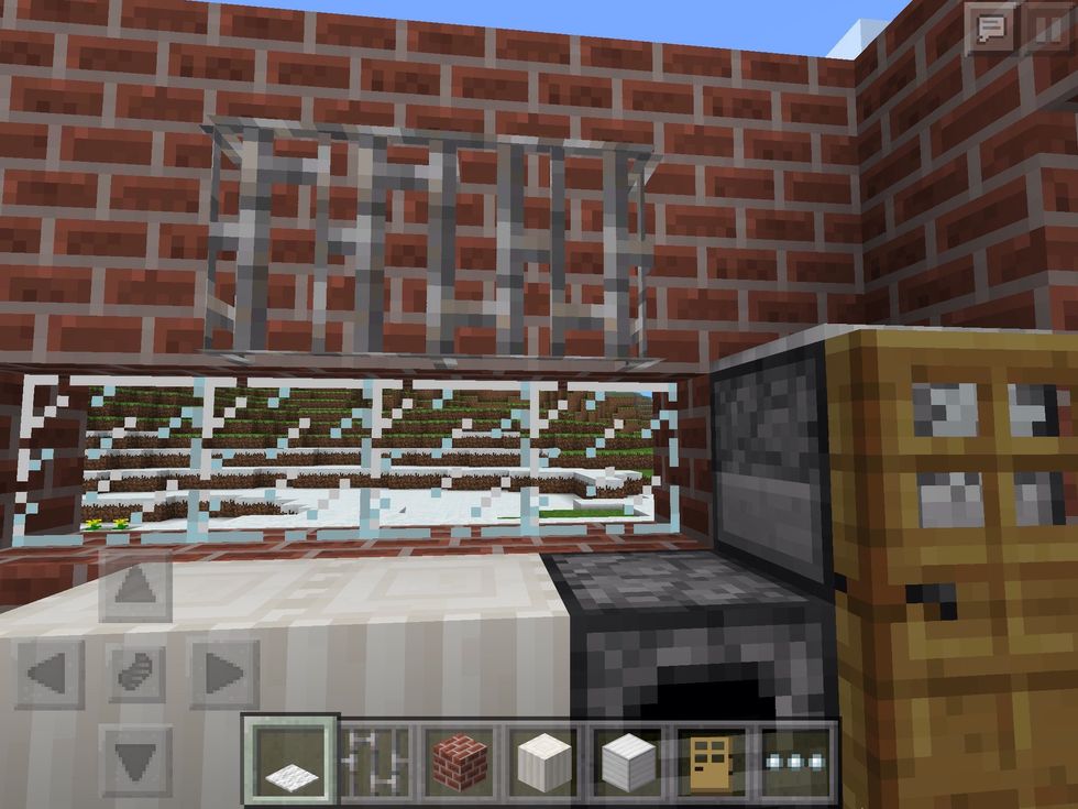Extra features for the kitchen! Iron bars look like hanging racks above the cooker.