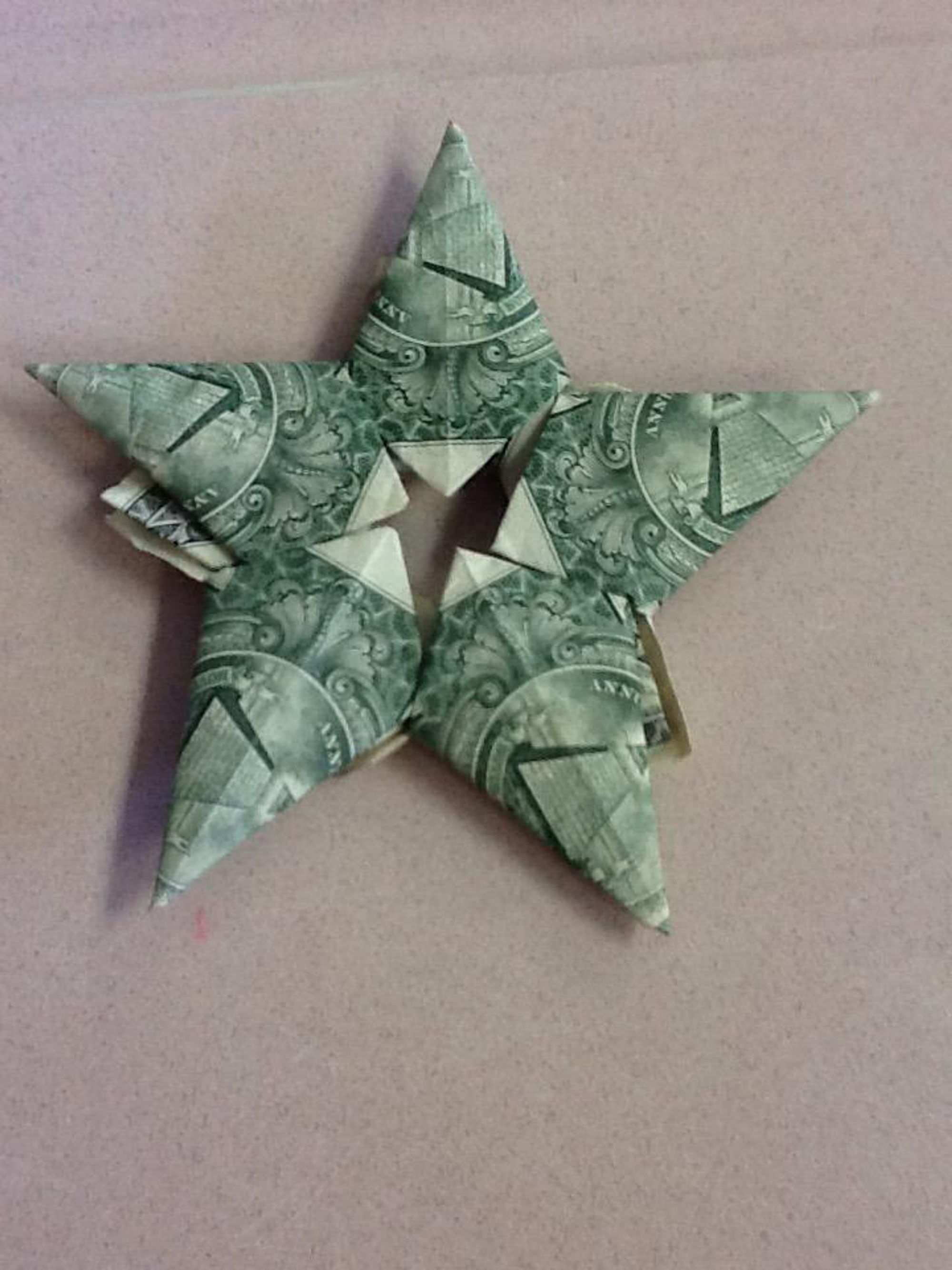 How to make an origami star out of dollar bills - B+C Guides