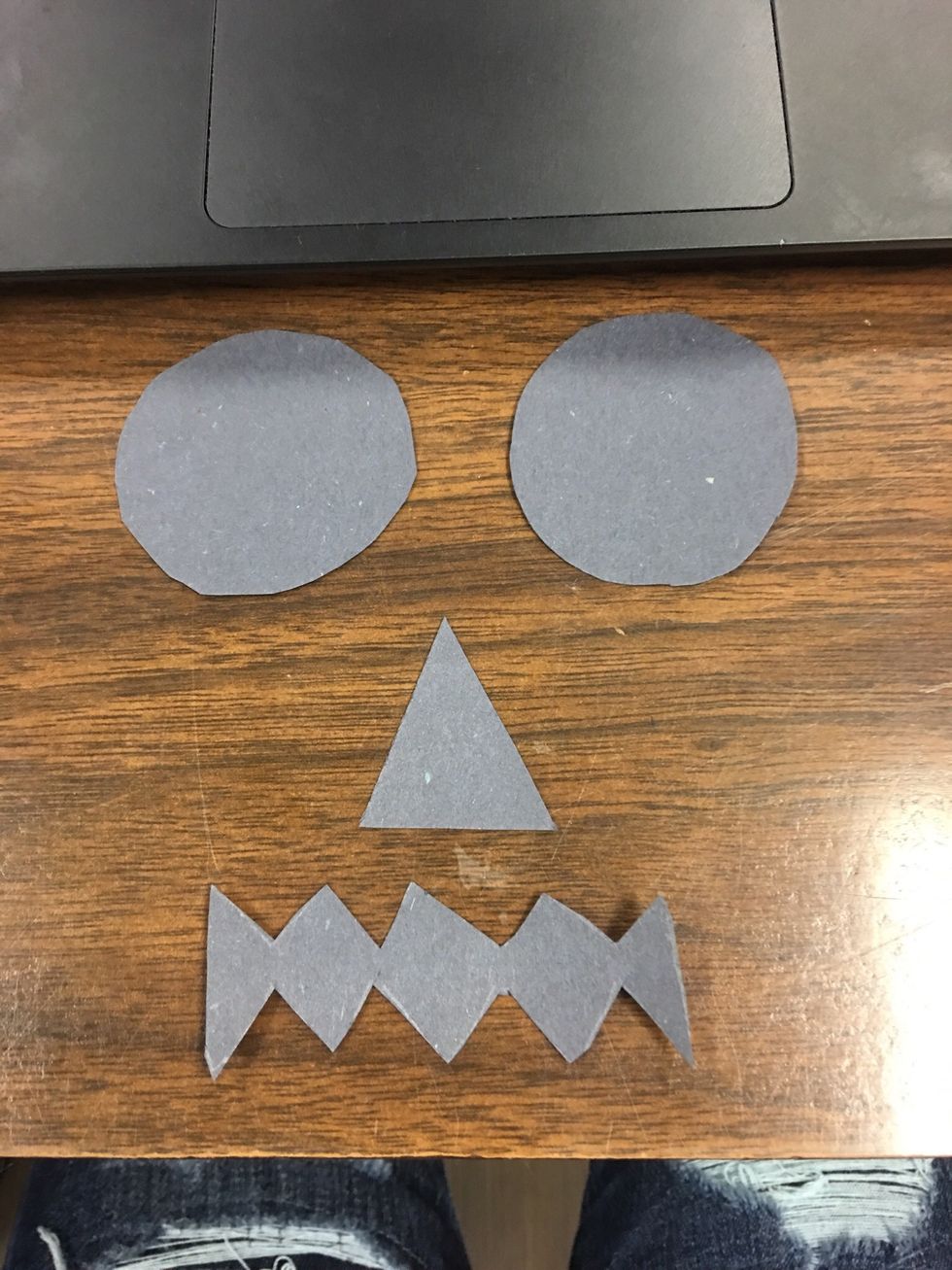 Your going to take the black construction paper and cut out 2 circles