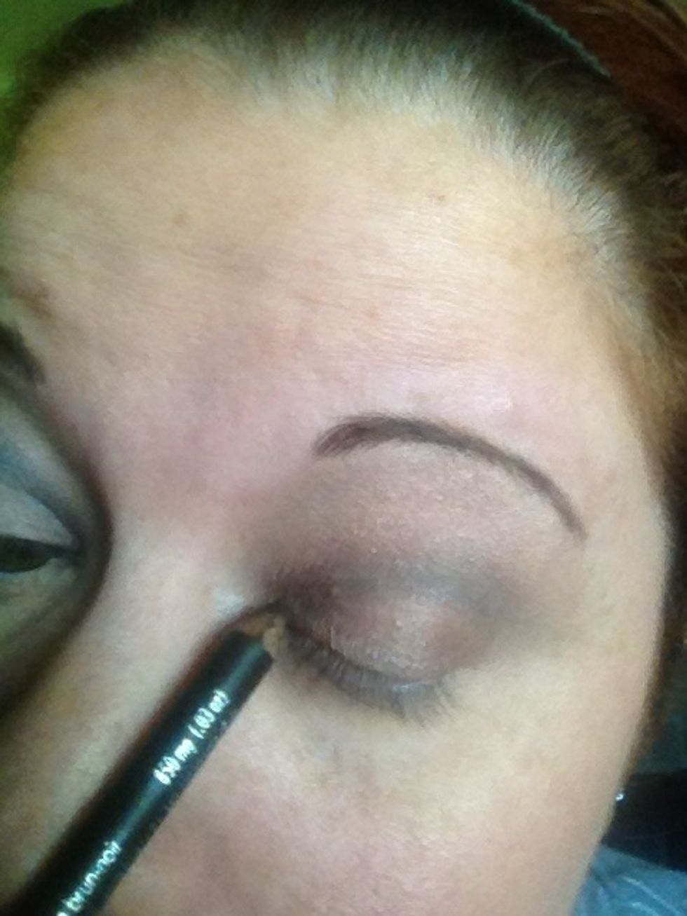 Eyeliner time. Dull pencil works best and a steady hand.