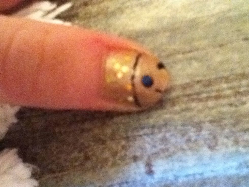 Fabulous Dalek time! Draw the black detail first, then the blue eye-stalk. Add either little dots in brown or gold sparkles (like I did) for the pattern. Exterminate!