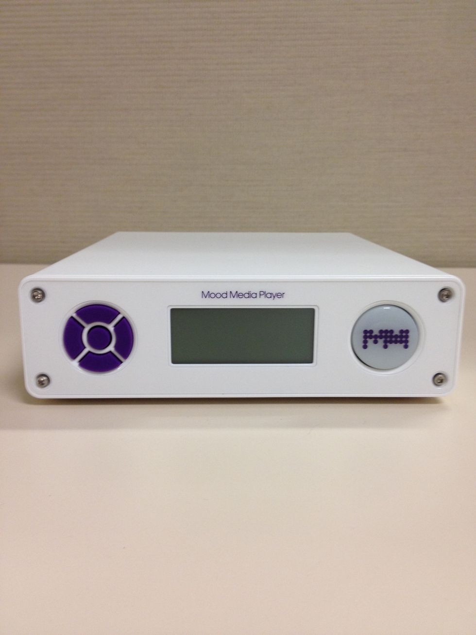 Familiarize yourself with the front panel. From left to right re the Controls, Display, and Mood Button.