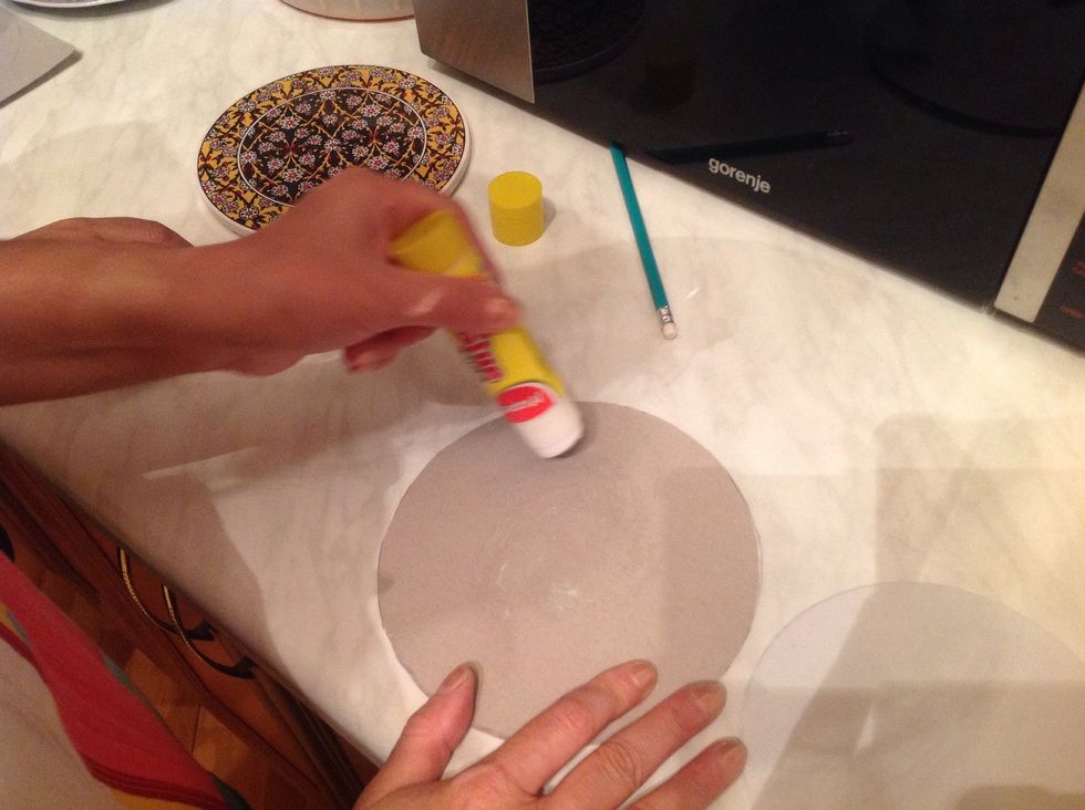 Fasten several cartons with stapler or glue to one another.