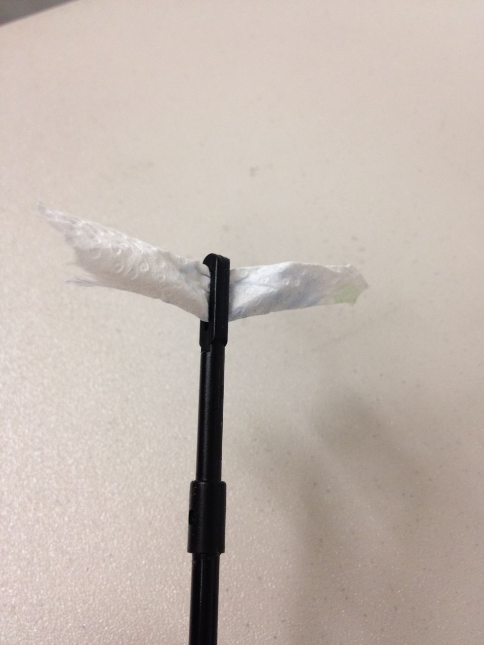 Feed it through the eye of the cleaning rod.