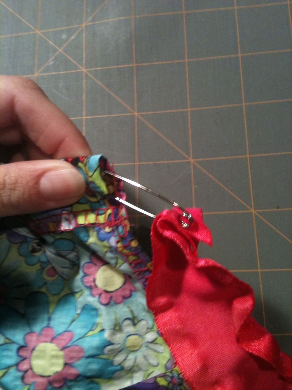 Feed ribbon through both casings at the top front and back of the dress.