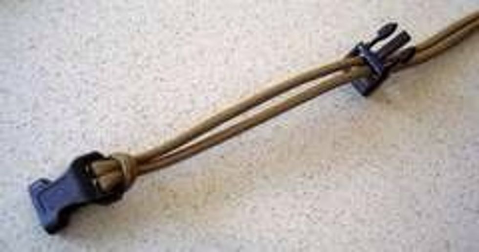 Feed the other end through the other shackle/ buckle.