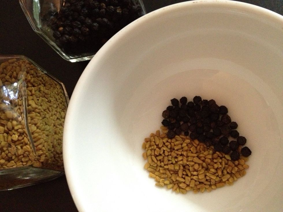 Fenugreek and whole black pepper. Note, the black pepper which is not ground are optional. Even if you like it hot, others may not & so they can opt to not eat it when they find it while eating.