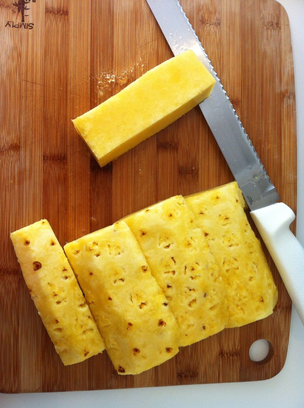 Fibrous core on top (discard, if you don't like it), pineapple 'meat' on bottom. If doing sushi, at this point you can cut thin strips of pineapple and use for sushi.
