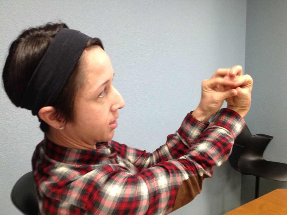 Fifth, bring your thumbs to touch each other as well as your pinky fingers.