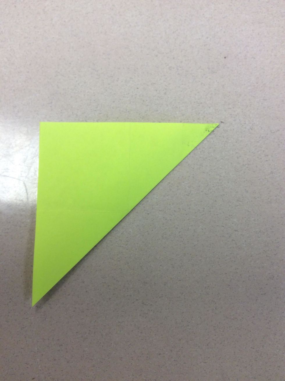 Fifth, take the right bottom corner and fold it to the left top corner. It should look like a triangle.