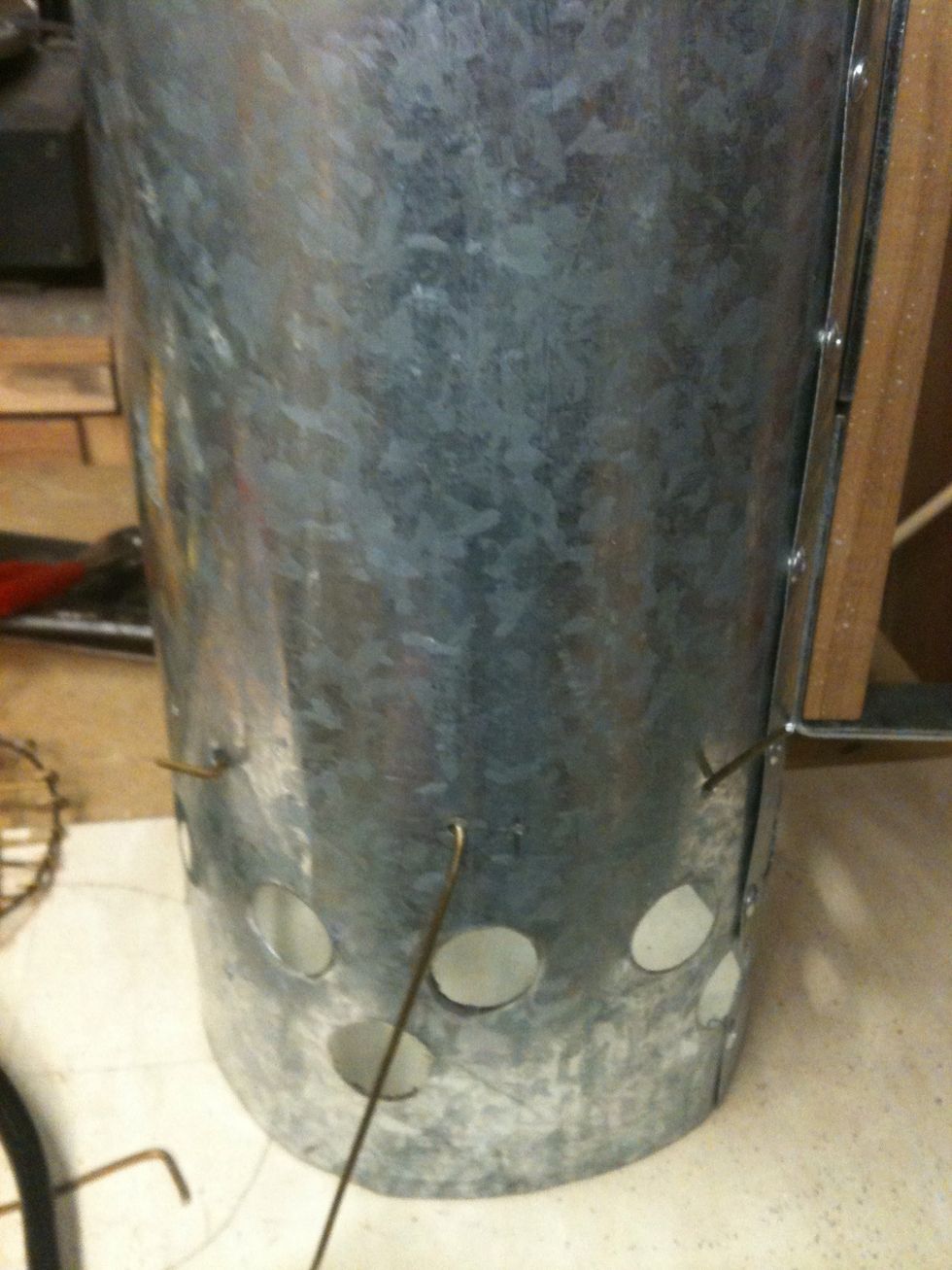 Figure out where you want to put the screen. I put mine about 5" from the bottom. I drilled three holes on either side so I could support the shelf. The holes have wire in them so you can see them.