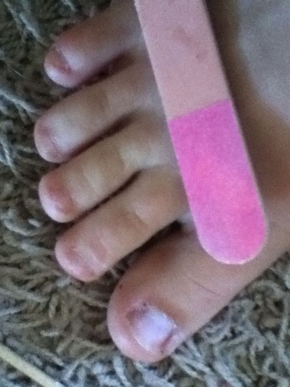 File the surface of your nail to give the gel something to stick to (: