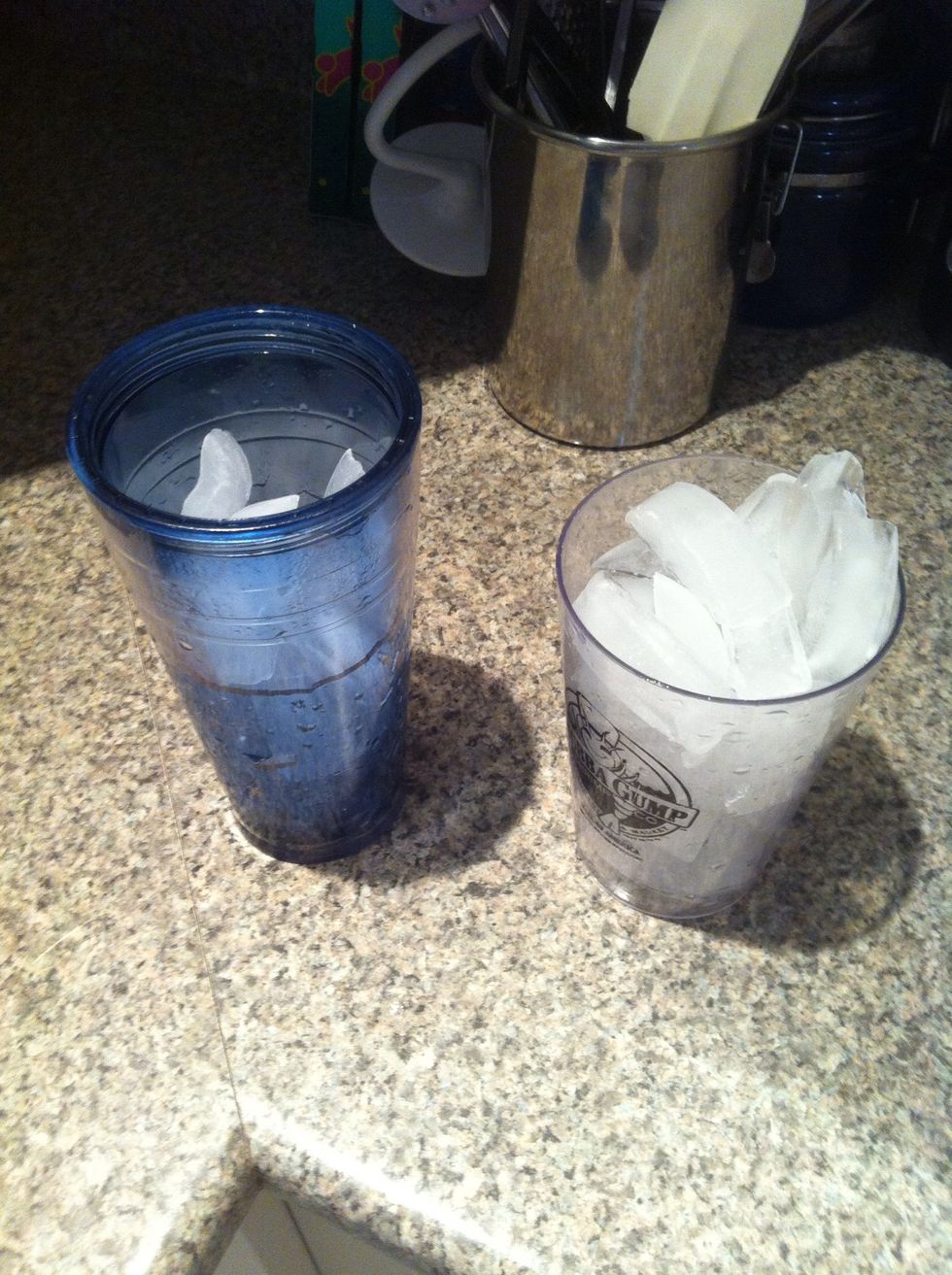 Fill 2 cups with ice. One for shaking, the other for drinking