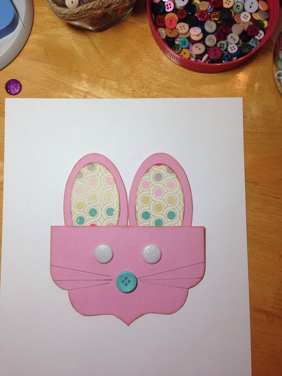 Fill a bag with candy and place it between the two brackets. Staple the layers together and you will have a darling....