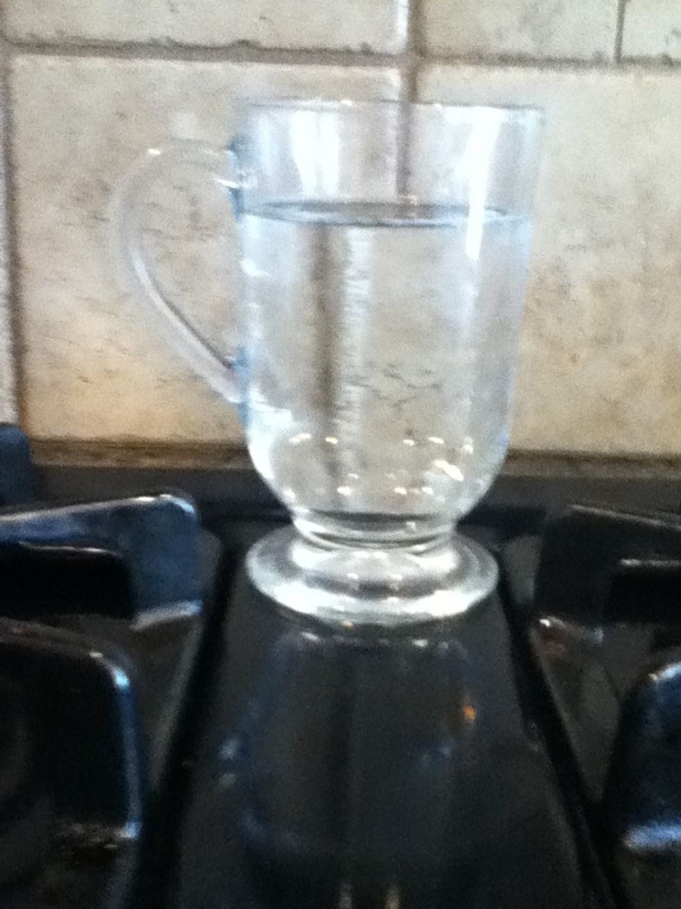 Fill a cup up with milk or water