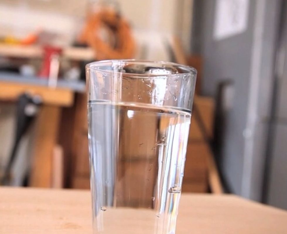 Fill a glass with water.