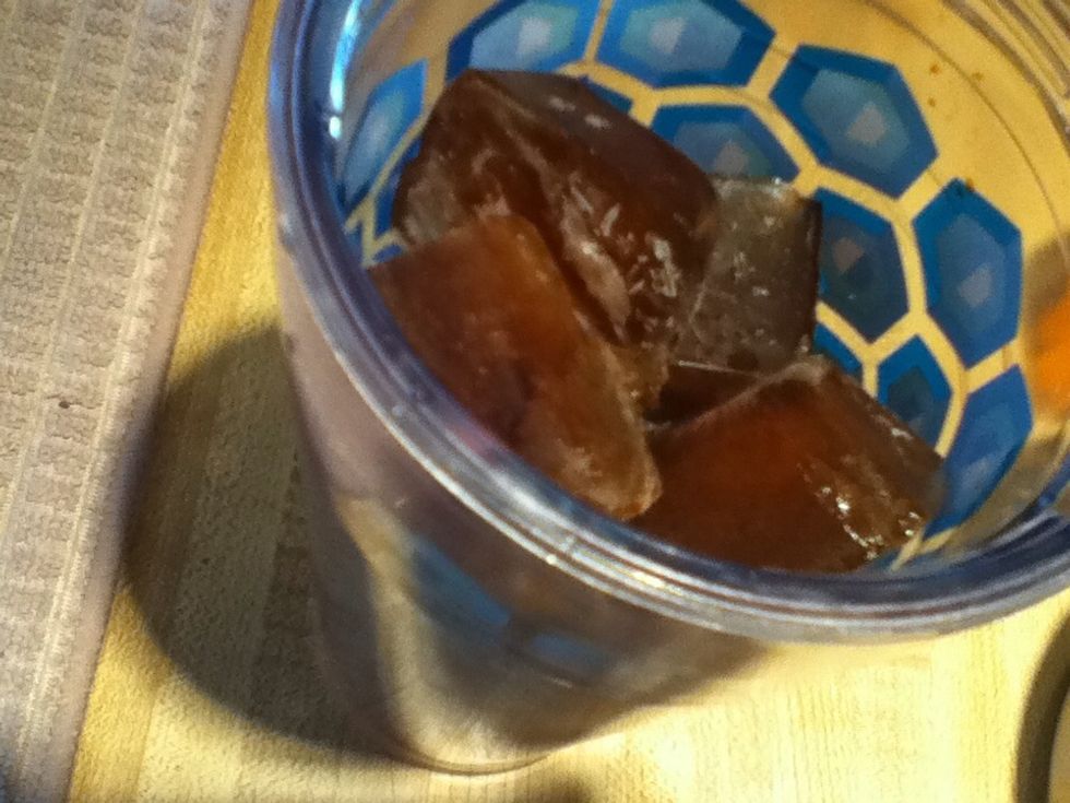 Fill a large cup with your coffee cubes.