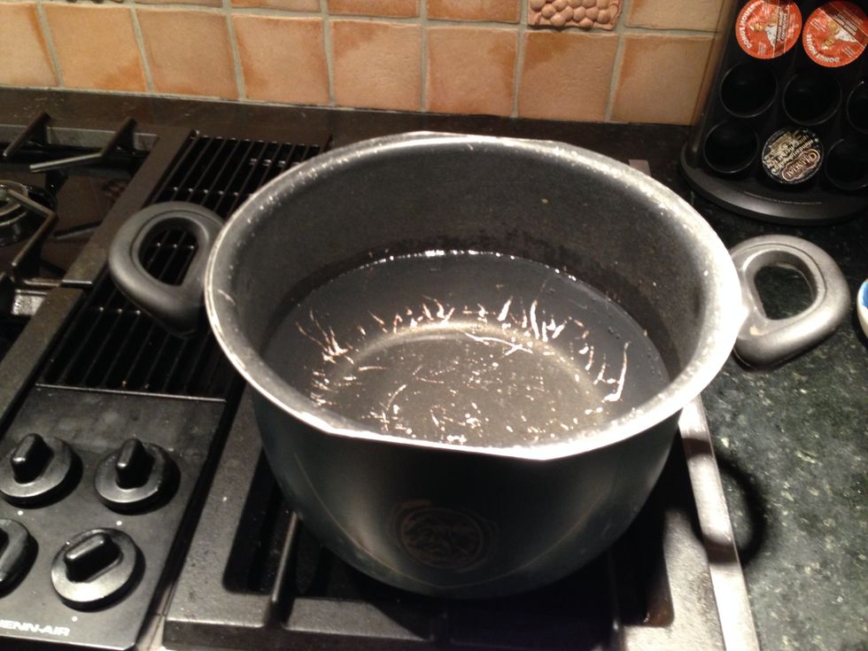 Fill a large (pasta) pot 1/2 full of water. Turn on high, we want it to boil. No need to wait for the boil...
