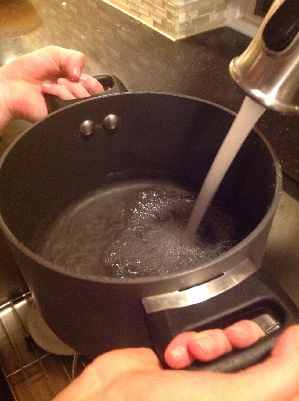 Fill a large pot 3 quarters full and put on the boil.