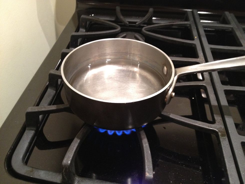 Fill a pot with water, and turn on the flame.