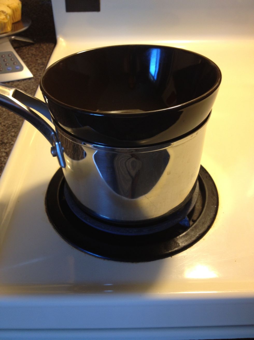 Fill a small pot about 1/3 the way full of water. Bring to a boil then turn down to low so water is just summering lightly. Place a bowl over pot. Make sure bowl fits well an creates a good seal.