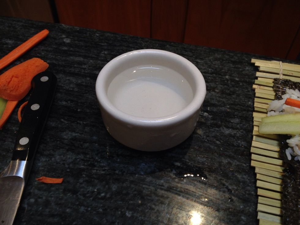 Fill a small ramekin with cold water.