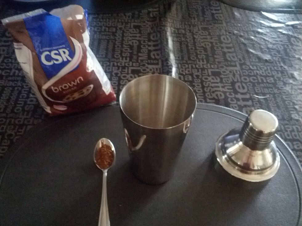 Fill a teaspoon of instant coffee (To taste) and pour into the cocktail shaker. (One teaspoon for a cup, and 1/2 for every cup after that). If the coffee is too weak, experiment until it's good.