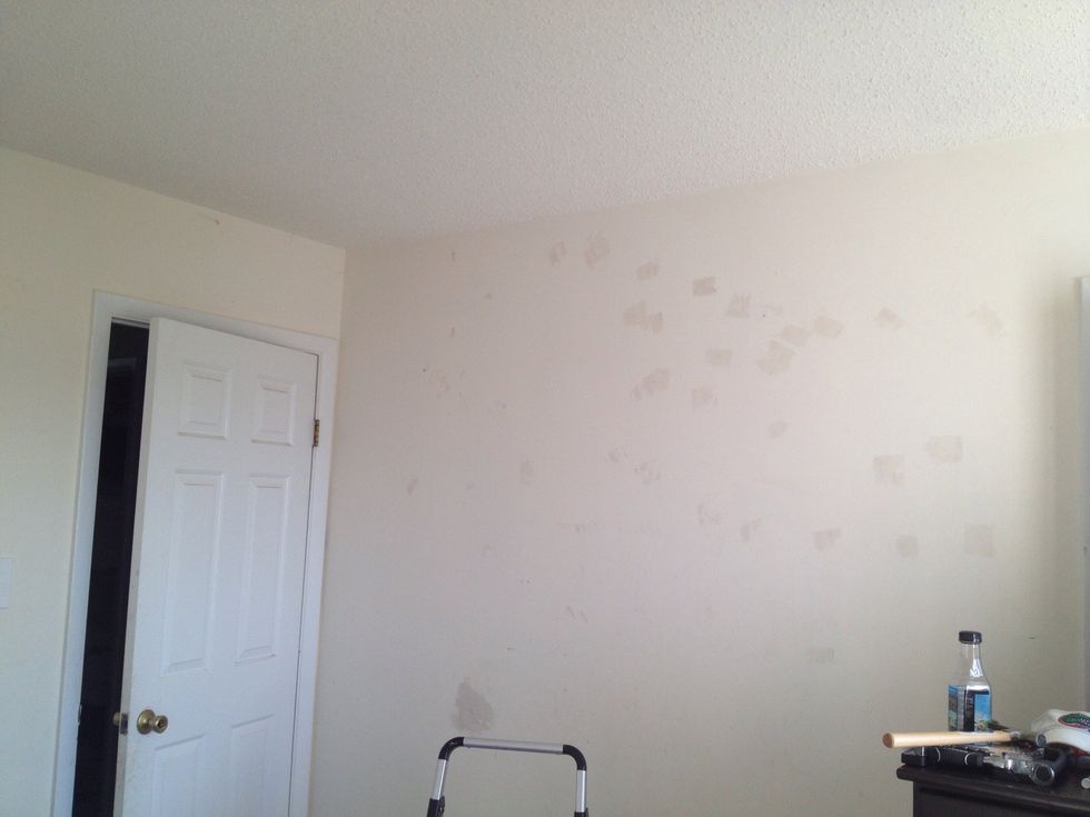 Fill any holes in wall from previously hung photos. Wait to dry completely then sand smooth.