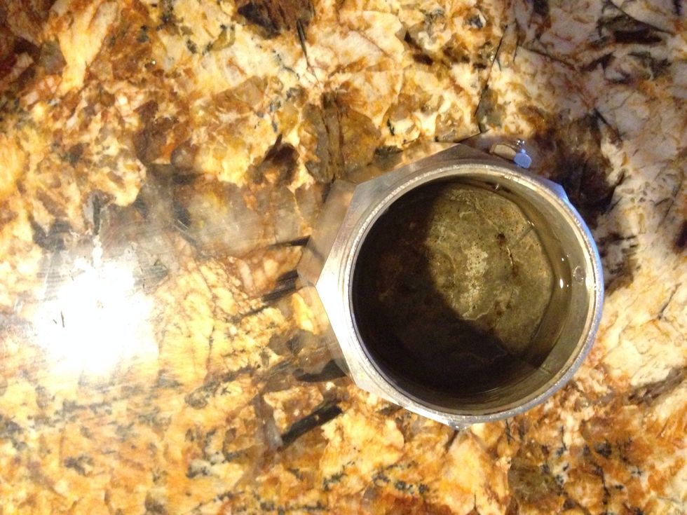 Fill base of espresso maker with water.
